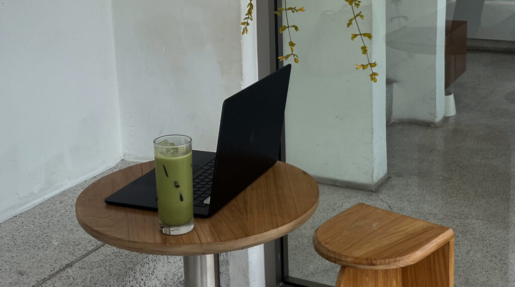 digital nomad laptop matcha on coffee table