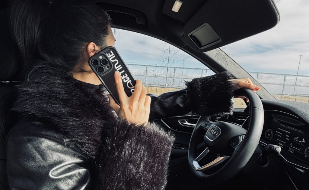 female ceo driving her car on the phone with a client